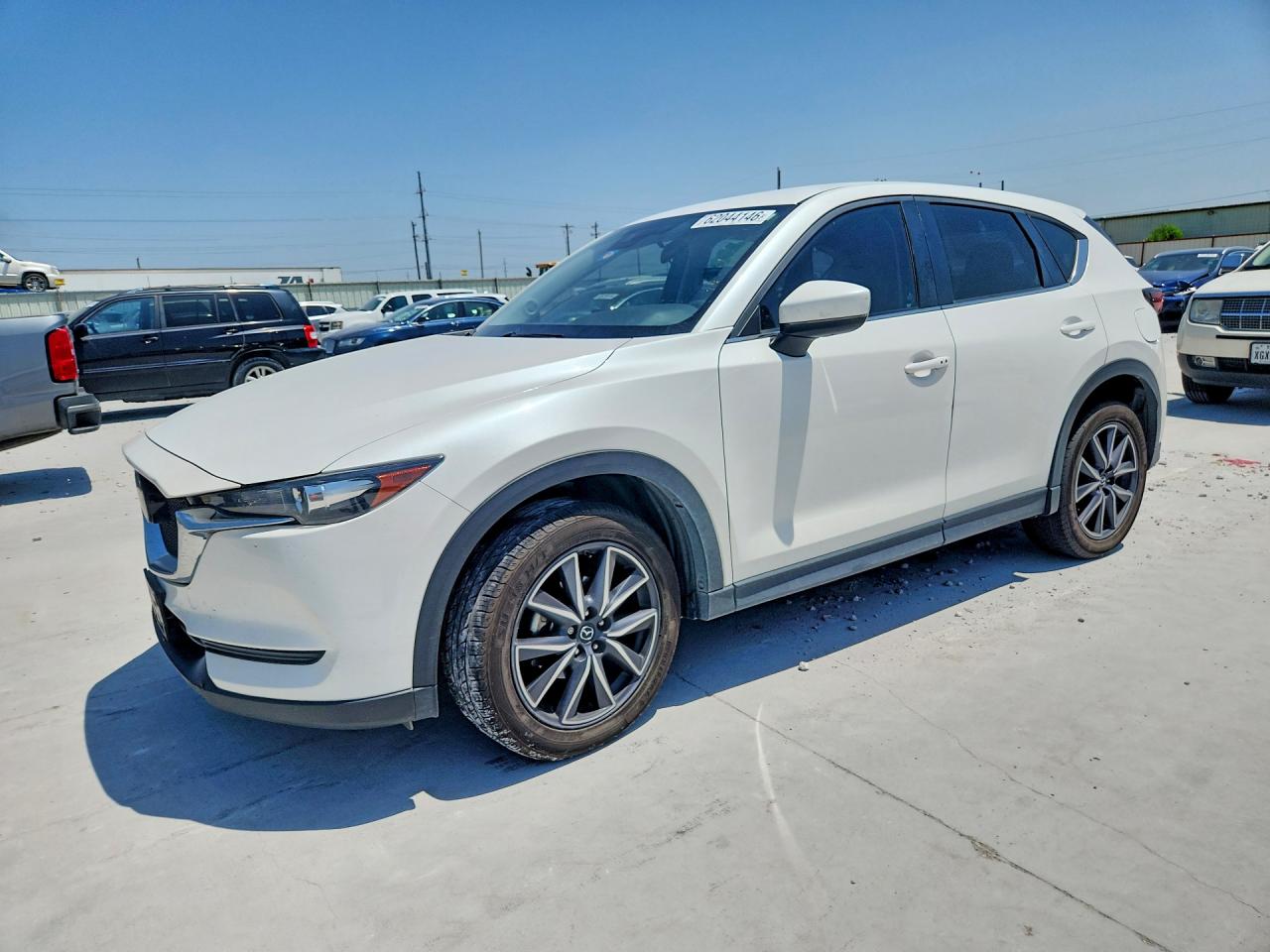 2018 Mazda CX-5 Touring, VIN JM3KFACMXJ1455534 — Side