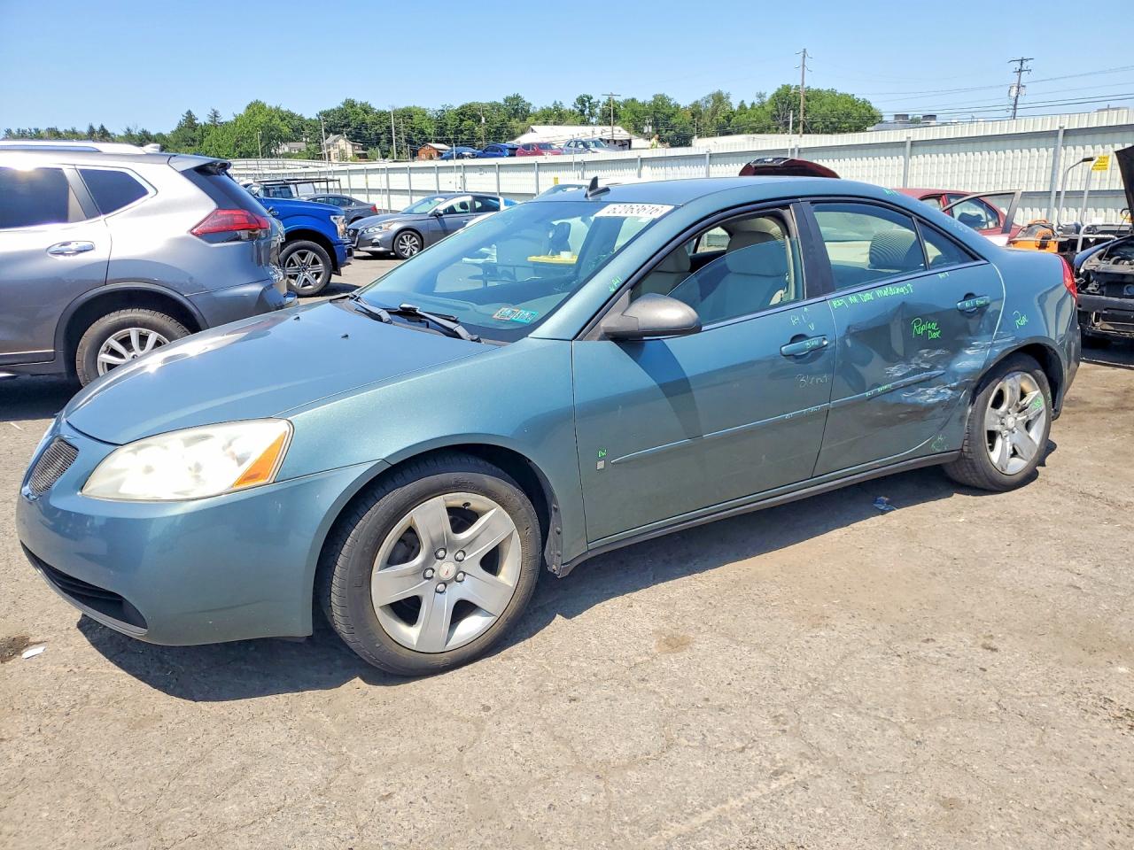2009 Pontiac G6 1SA, VIN 1G2ZG57B394219973 — Side