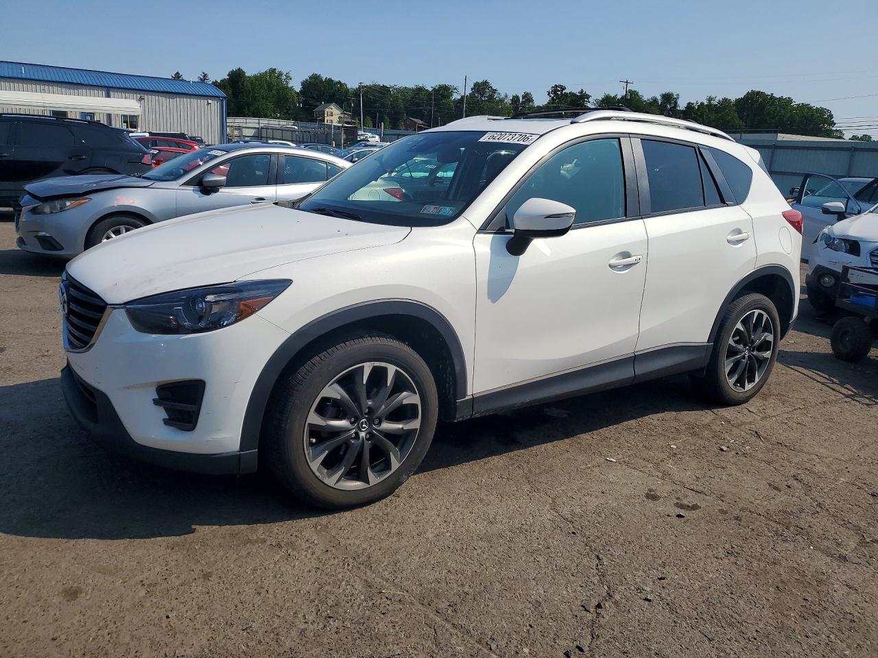 2016 Mazda CX-5 Grand Touring, VIN JM3KE4DY6G0705632 — Side