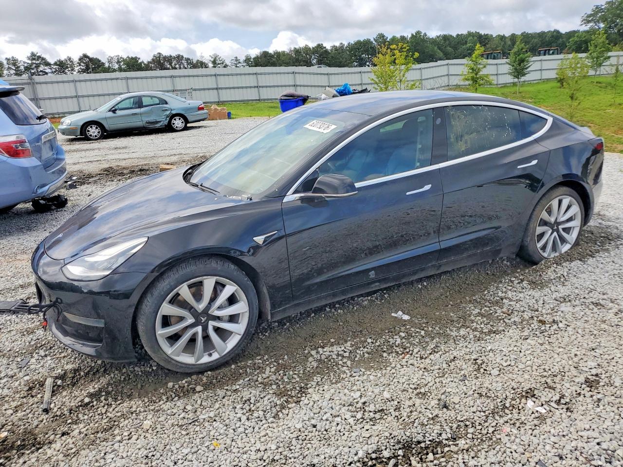 2020 Tesla Model 3 Standard Range Plus, VIN 5YJ3E1EA0LF660776 — Minor dents and scratches