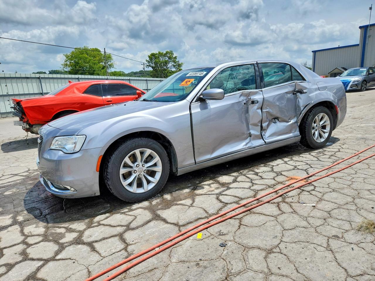 2015 Chrysler 300 Limited, VIN 2C3CCAAG3FH837906 — Side