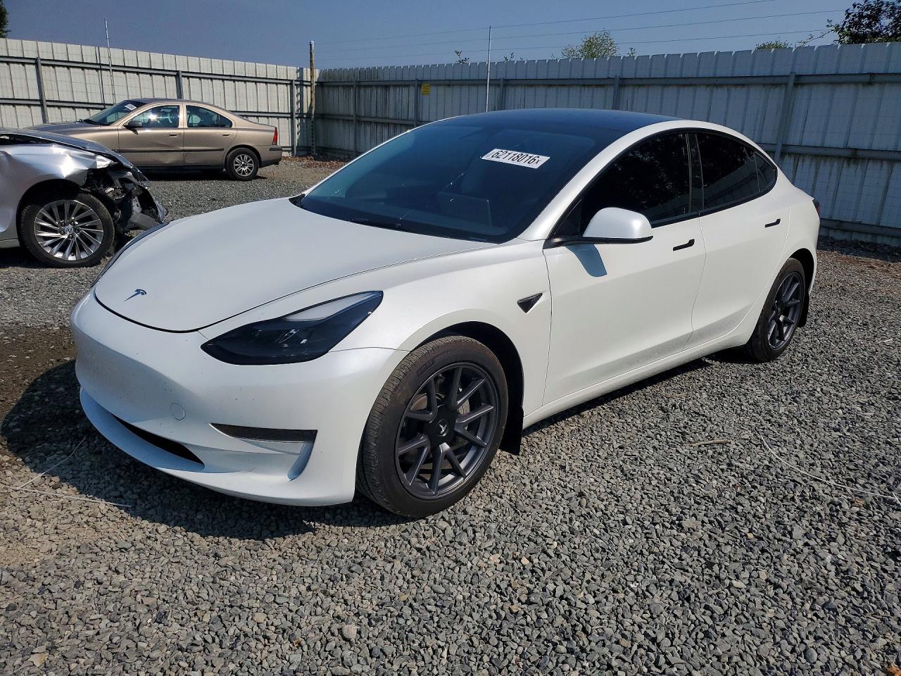 2023 Tesla Model 3, VIN 5YJ3E1EA4PF577969 — Side