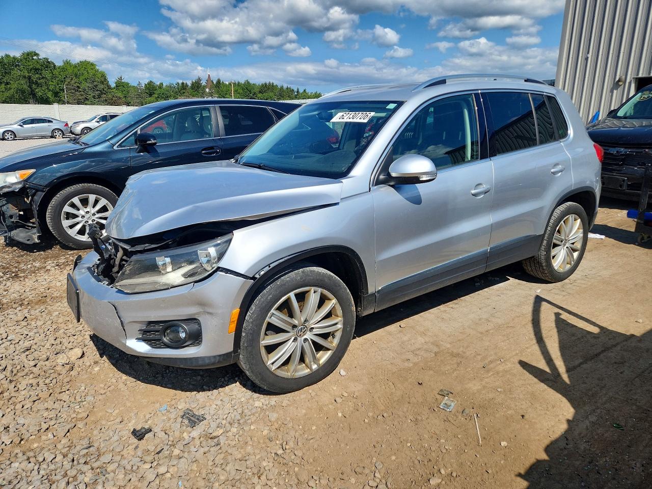 2015 Volkswagen Tiguan SEL, VIN WVGBV7AX6FW106100 — Front end