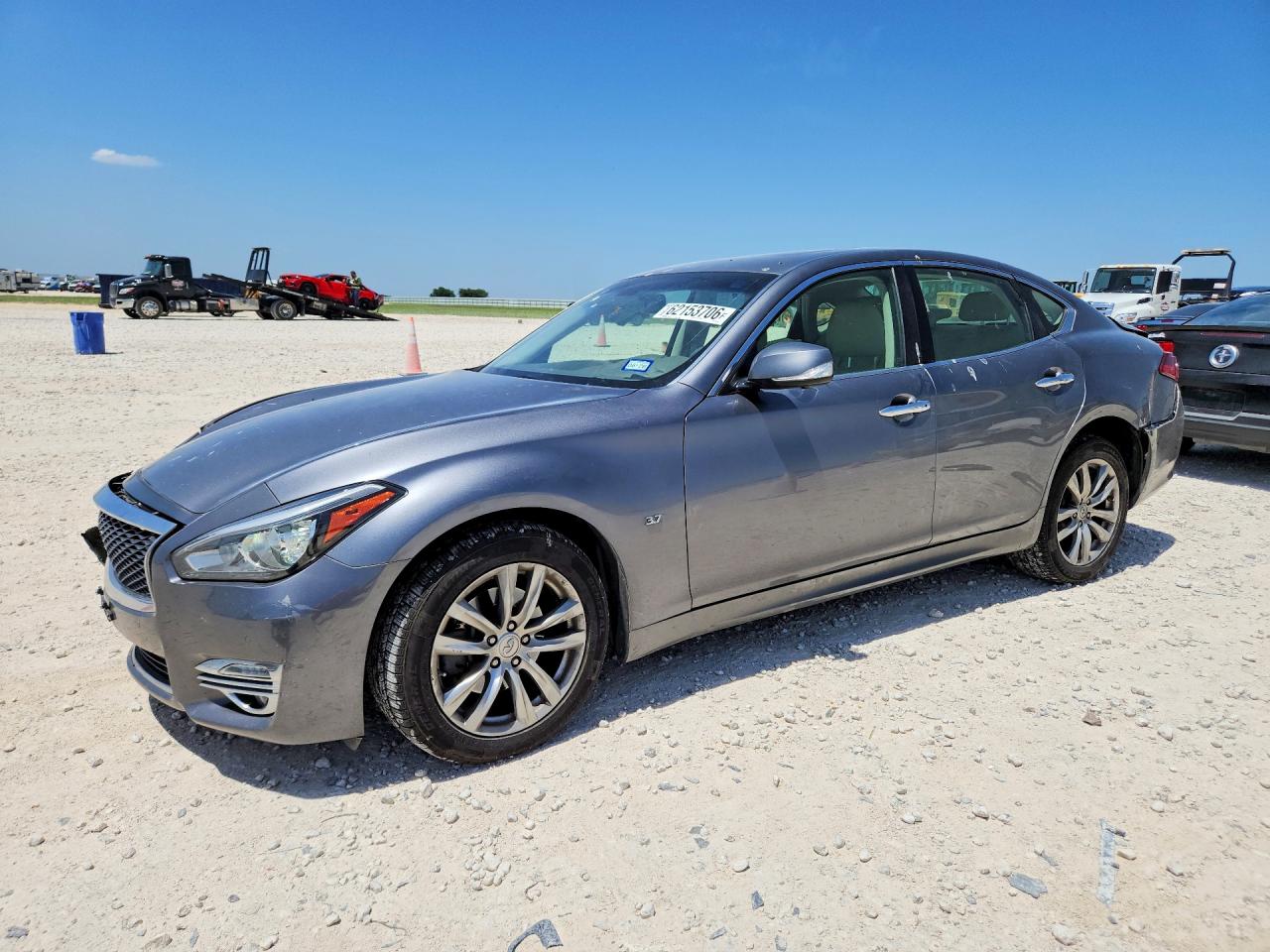 2015 Infiniti Q70, VIN JN1BY1AR1FM562143 — Rear end