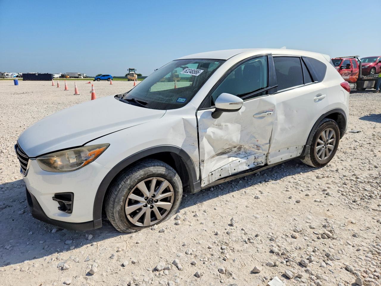 2016 Mazda CX-5 Touring, VIN JM3KE2CY0G0758669 — Side