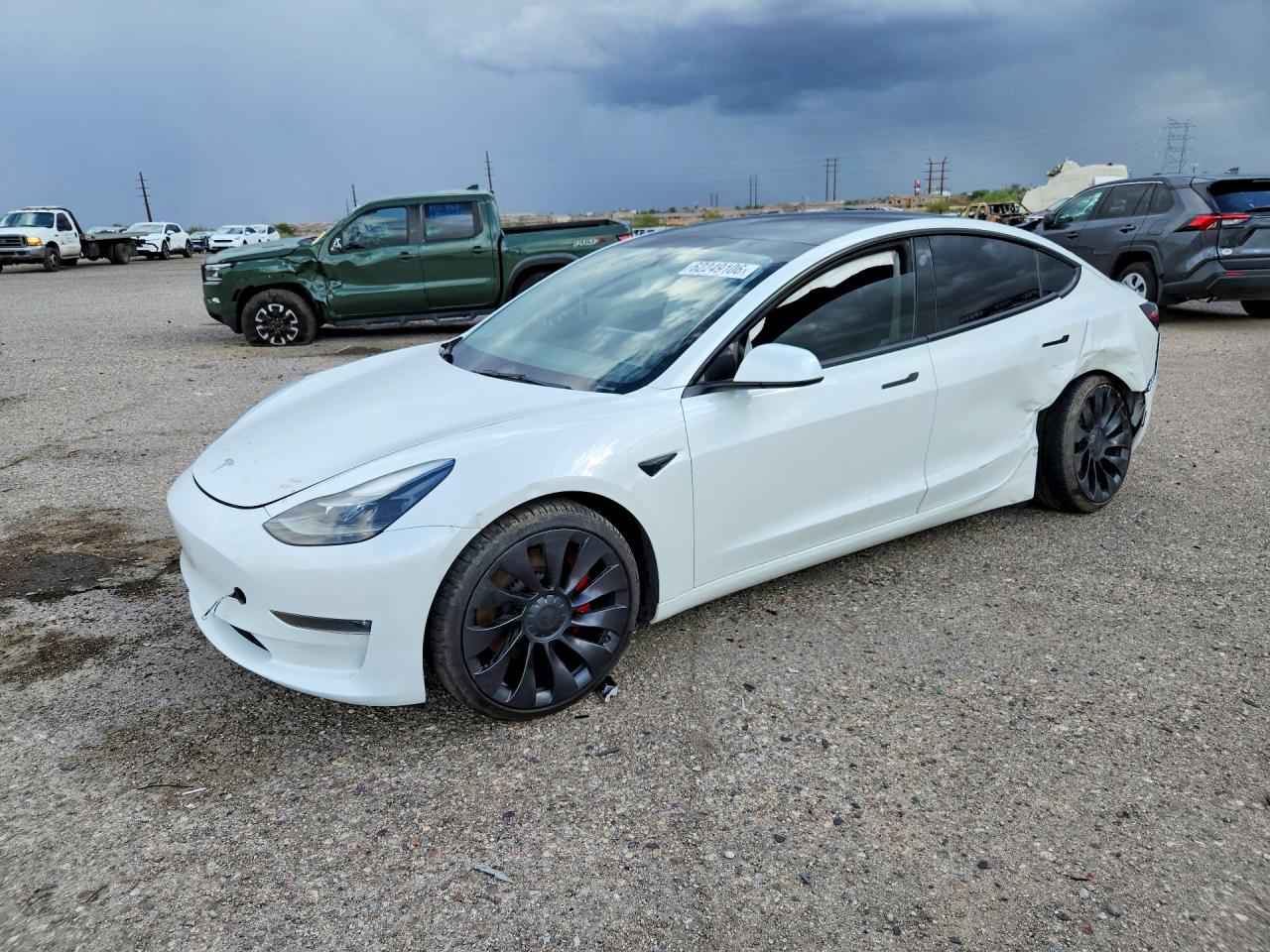 2023 Tesla Model 3 Performance, VIN 5YJ3E1EC4PF461382 — Side