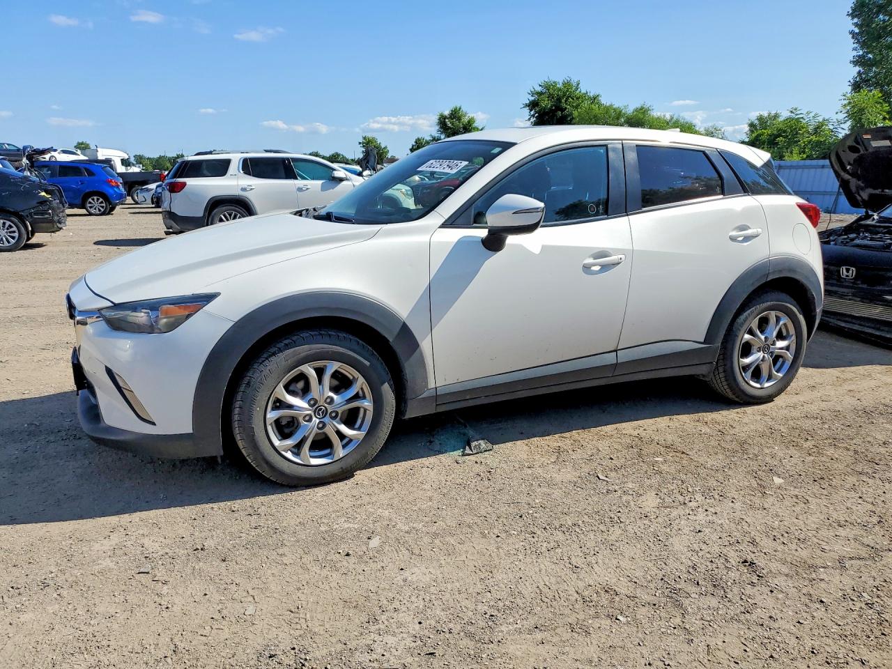 2016 Mazda CX-3 Touring, VIN JM1DKBC7XG0101119 — Side