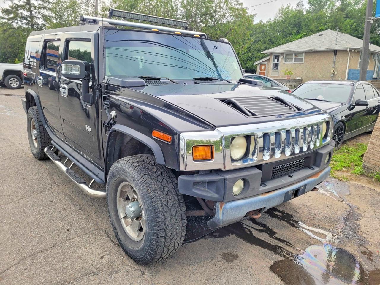 2004 Hummer H2, VIN 5GRGN23UX4H103507 — Undercarriage