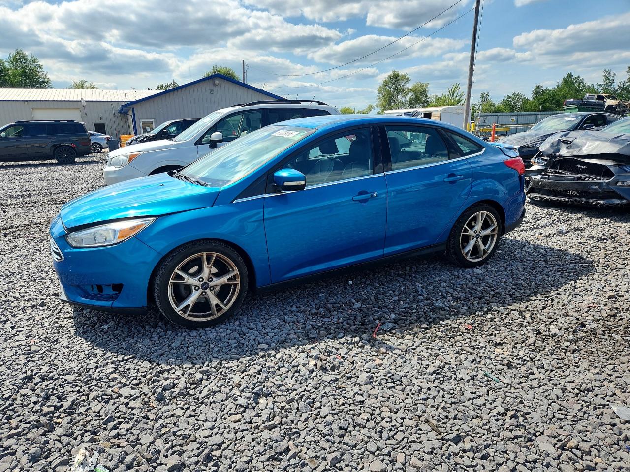 2016 Ford Focus Titanium, VIN 1FADP3J21GL233236 — Rear end