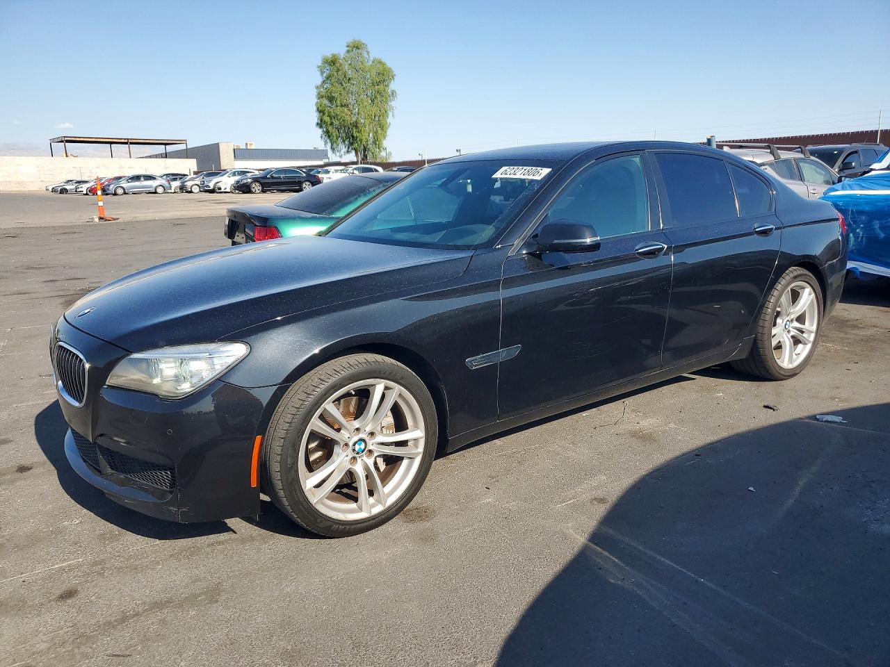 2015 BMW 7 Series 740i, VIN WBAYA6C50FGK16616 — Side