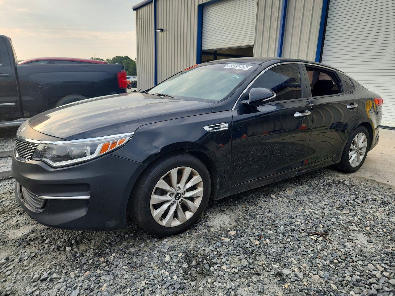 2016 Kia Optima LX, VIN 5XXGT4L33GG014972 — Vandalism