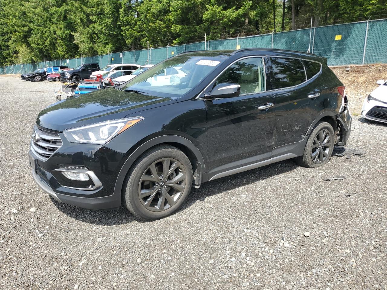 2017 Hyundai Santa Fe Ultimate, VIN 5XYZWDLA1HG502023 — Rear end