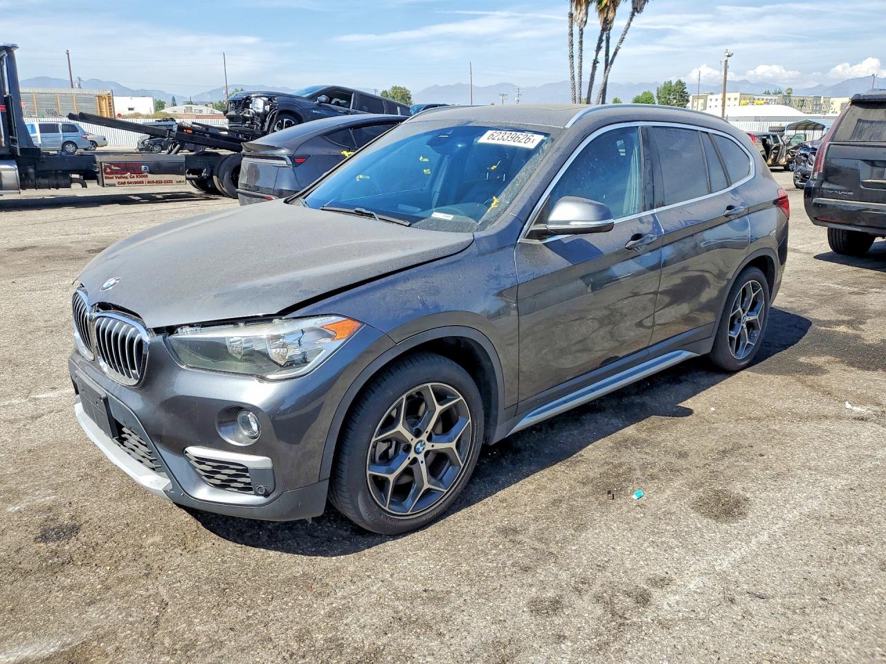 2019 BMW X1 xDrive28i, VIN WBXHT3C59K5L89166 — Minor dents and scratches