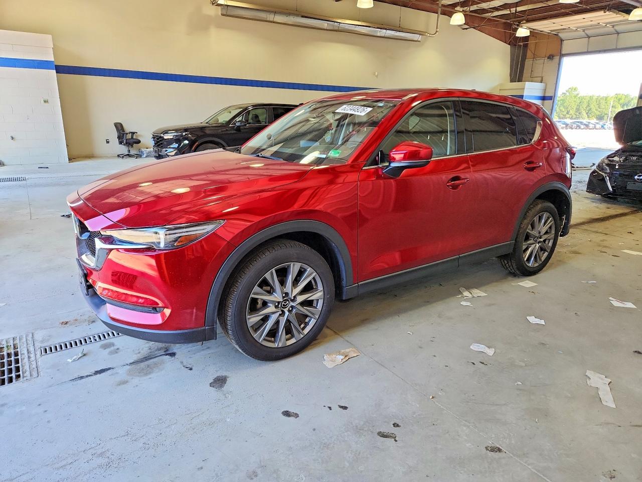 2021 Mazda CX-5 Grand Touring, VIN JM3KFBDM4M1371573 — Rear end
