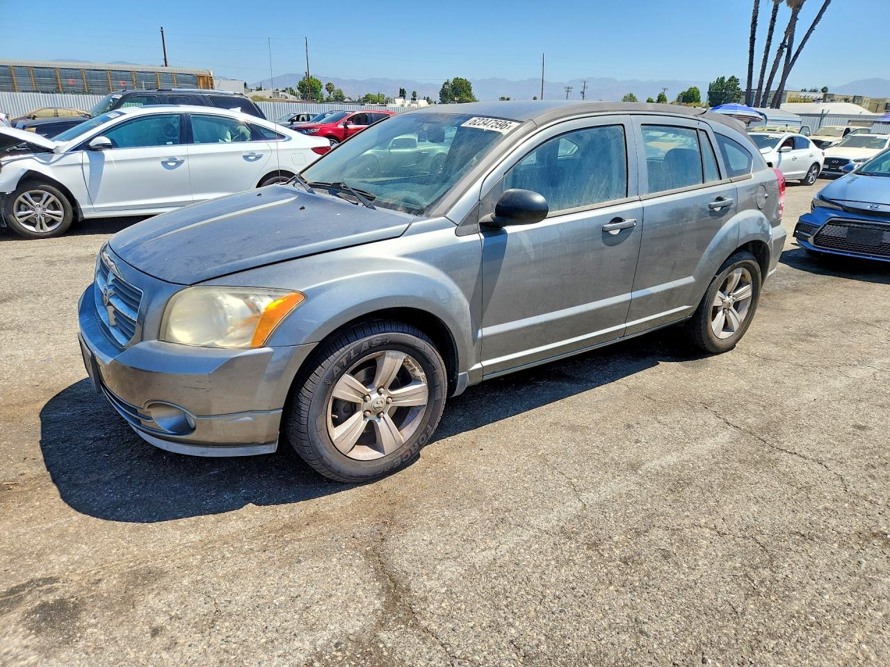2012 Dodge Caliber SXT, VIN 1C3CDWDA5CD507694 — Бок