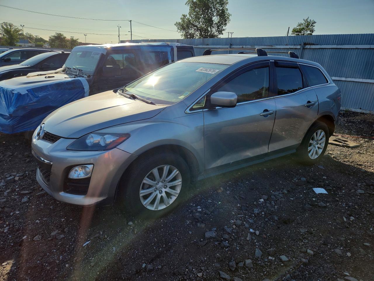 2011 Mazda CX-7 i Sport, VIN JM3ER2BM7B0406262 — Бок