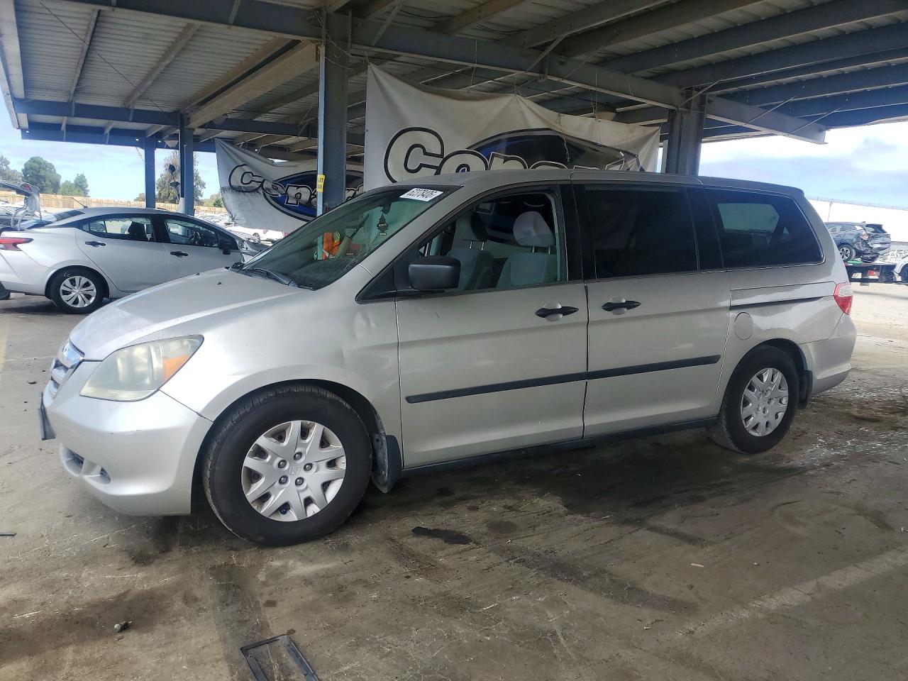 2007 Honda Odyssey LX, VIN 5FNRL38277B048340 — Side