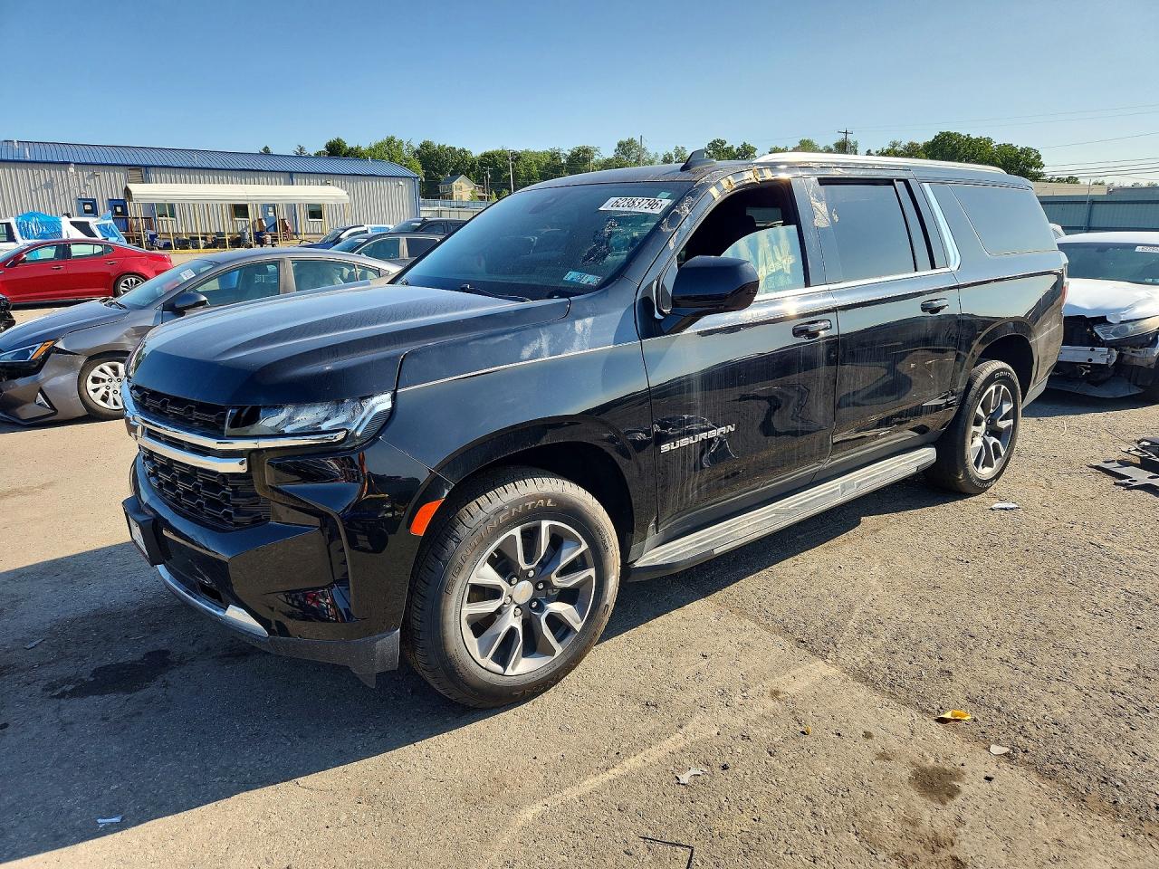 2021 Chevrolet Suburban LS, VIN 1GNSKBKD2MR280334 — Side