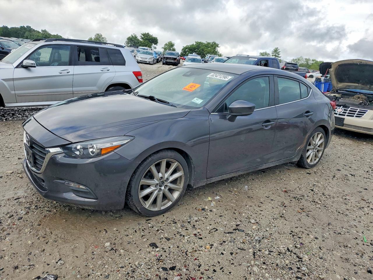 2017 Mazda 3 Touring, VIN 3MZBN1V73HM115980 — Бок