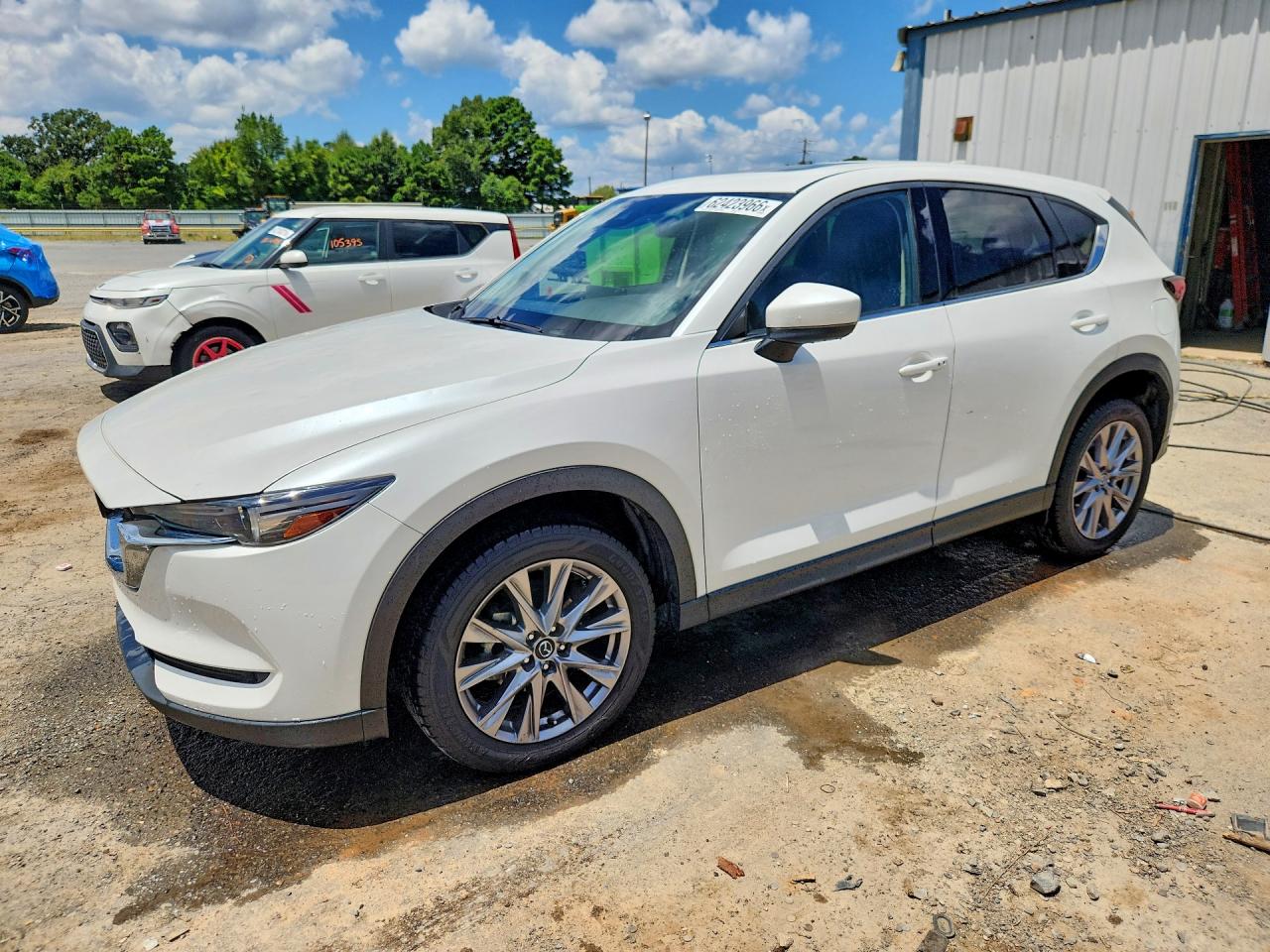 2021 Mazda CX-5 Grand Touring, VIN JM3KFADM3M0469851 — Hail
