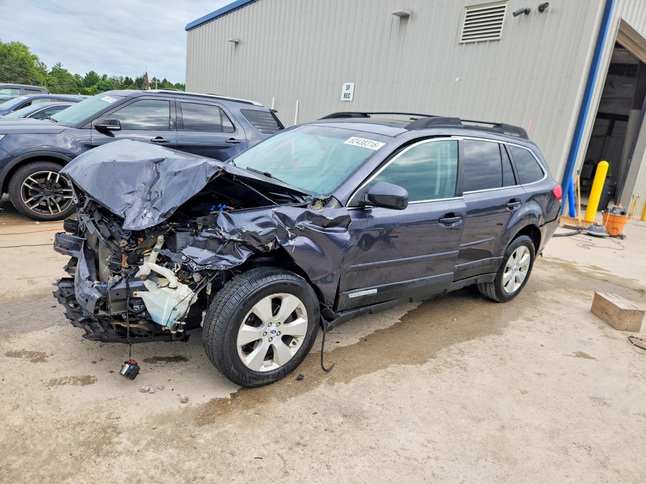 2012 Subaru Outback Limited, VIN 4S4BRCKC3C3203440 — Side