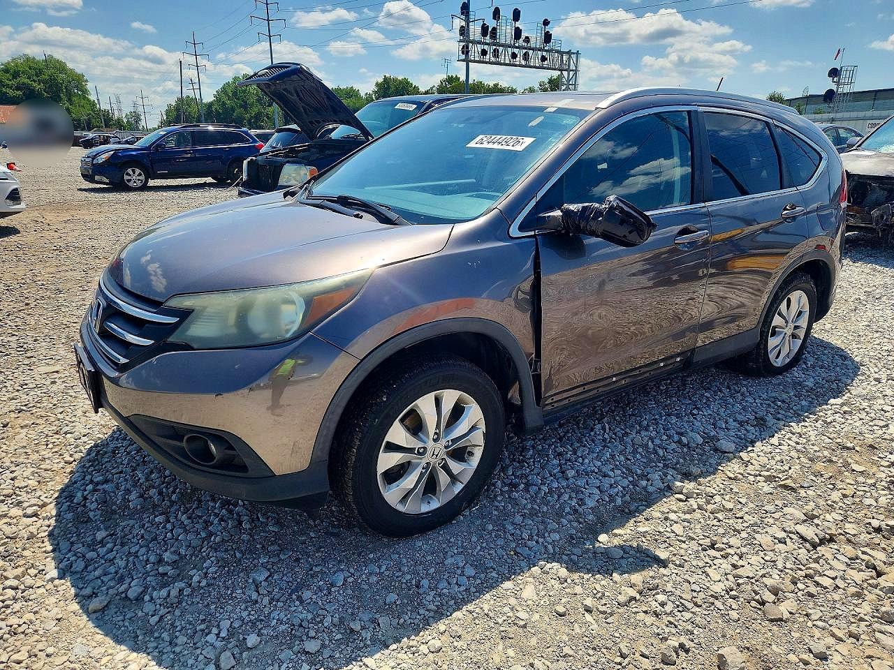 2014 Honda CR-V EX-L, VIN 2HKRM4H7XEH628212 — Vandalism