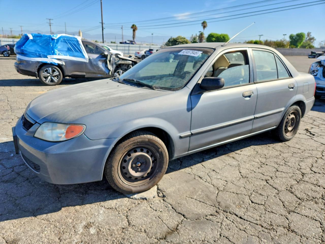 2001 Mazda Protege DX, VIN JM1BJ222010444965 — Rear end