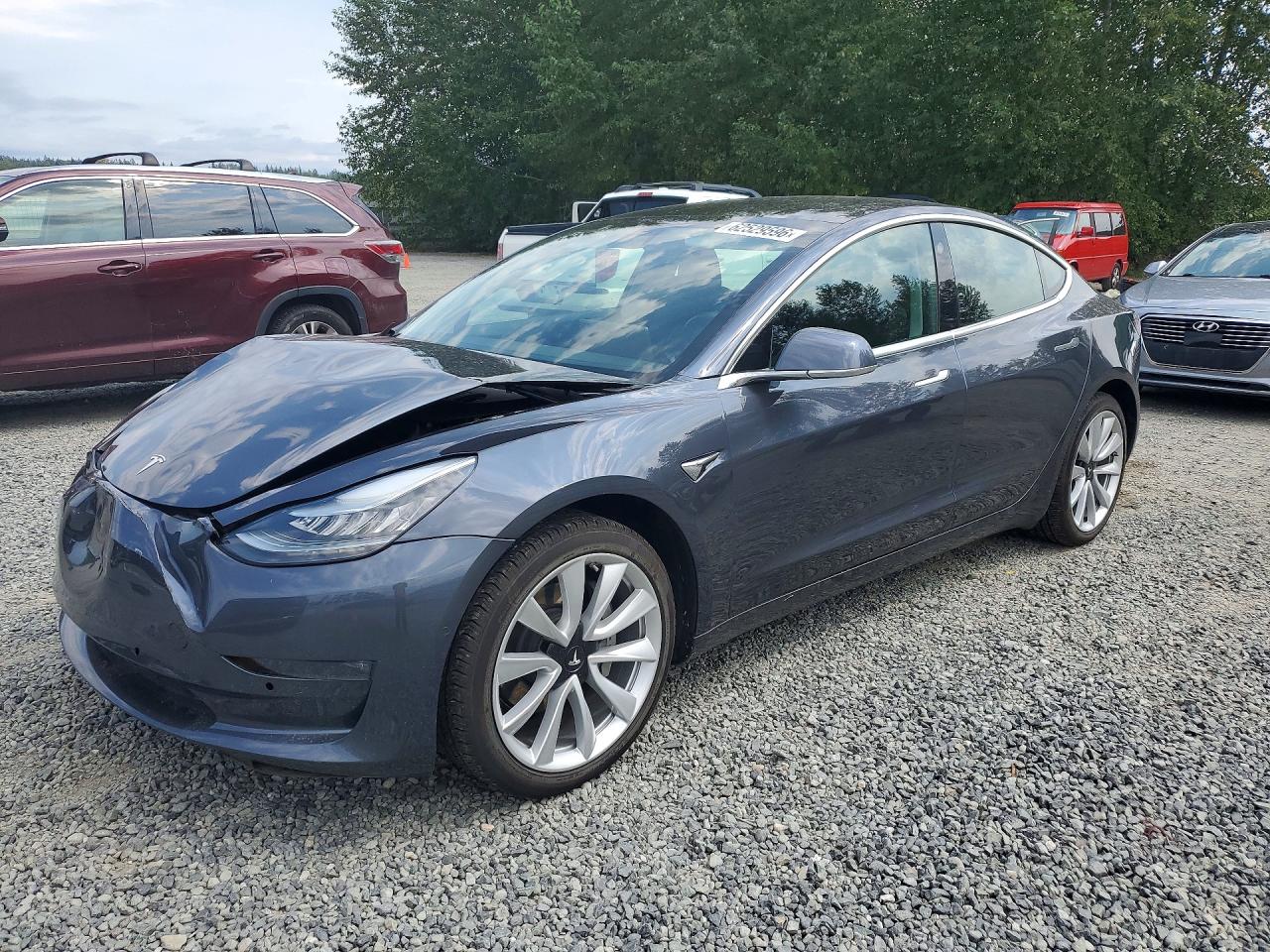 2019 Tesla Model 3 Mid Range, VIN 5YJ3E1EA5KF311255 — Front end