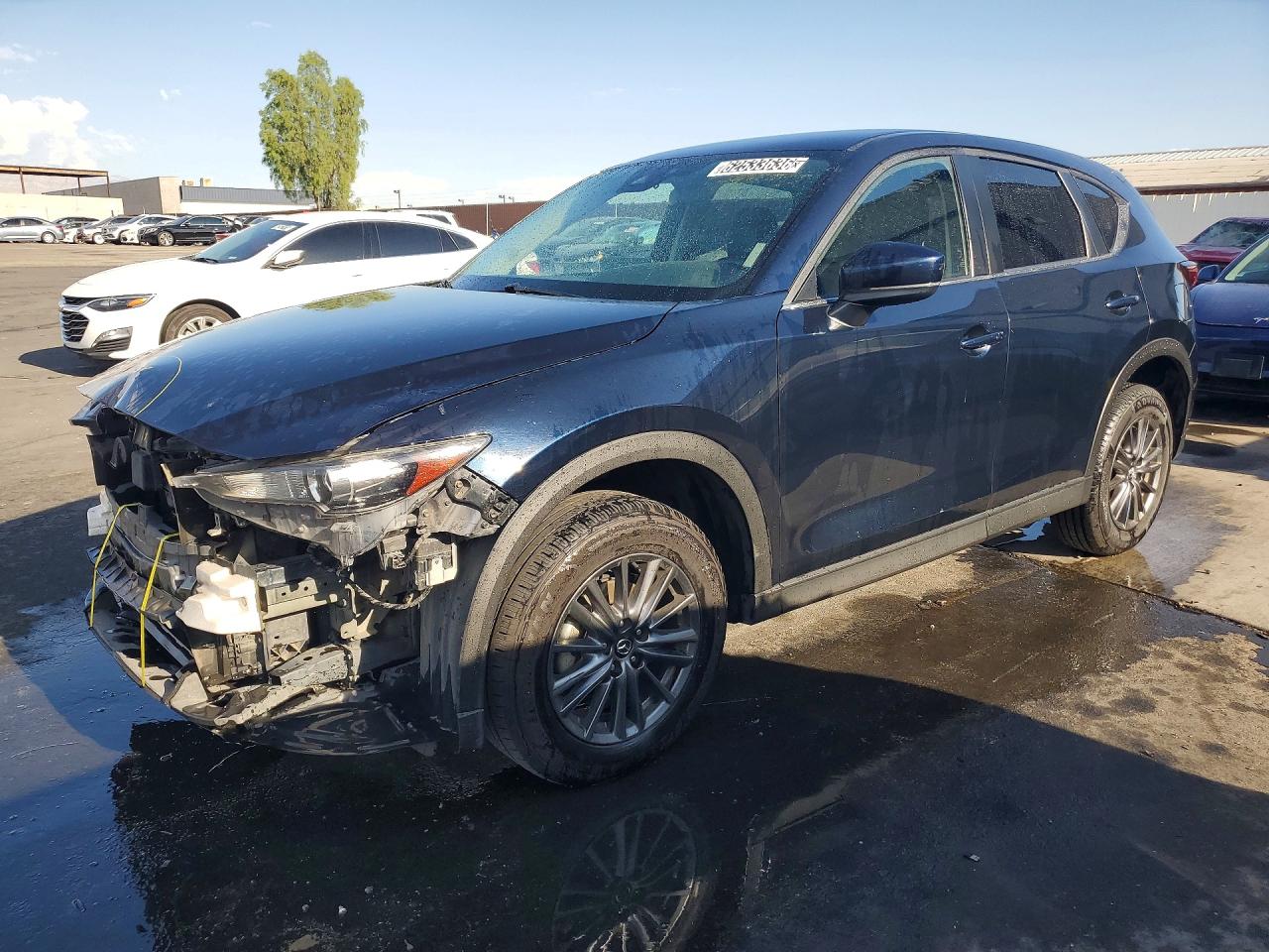 2021 Mazda CX-5 Touring, VIN JM3KFBCM1M0324511 — Front end