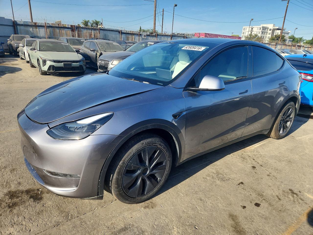 2025 Tesla Model Y Long Range, VIN 7SAYGDEE7SF240633 — Side