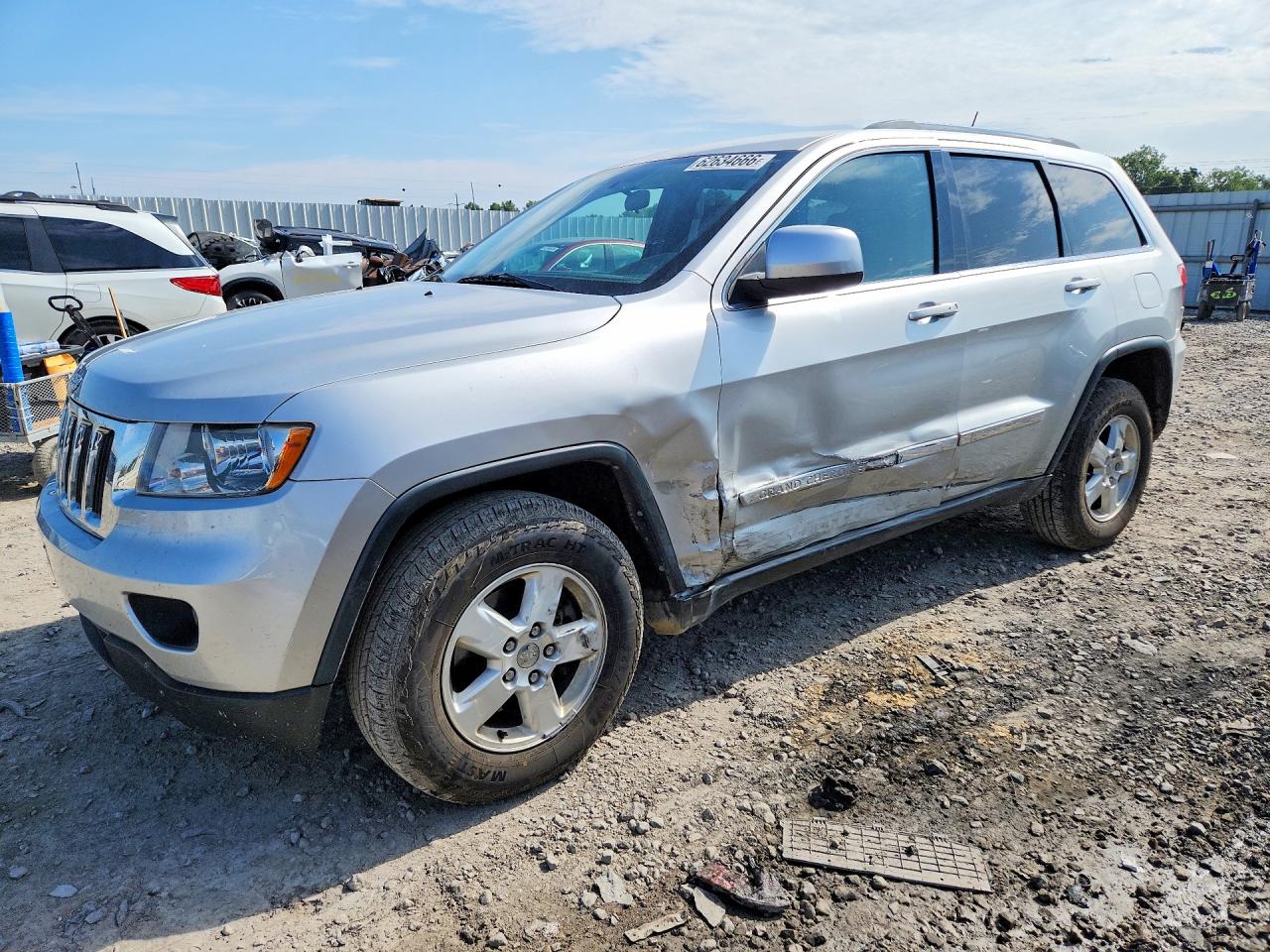 2012 Jeep Grand Cherokee Laredo, VIN 1C4RJFAG9CC263481 — Side