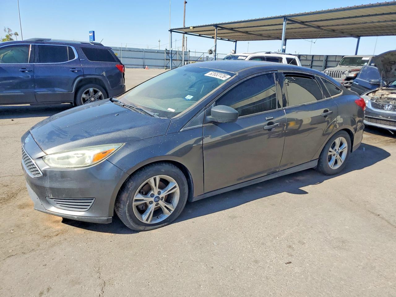 2016 Ford Focus S, VIN 1FADP3E28GL360429 — Minor dents and scratches