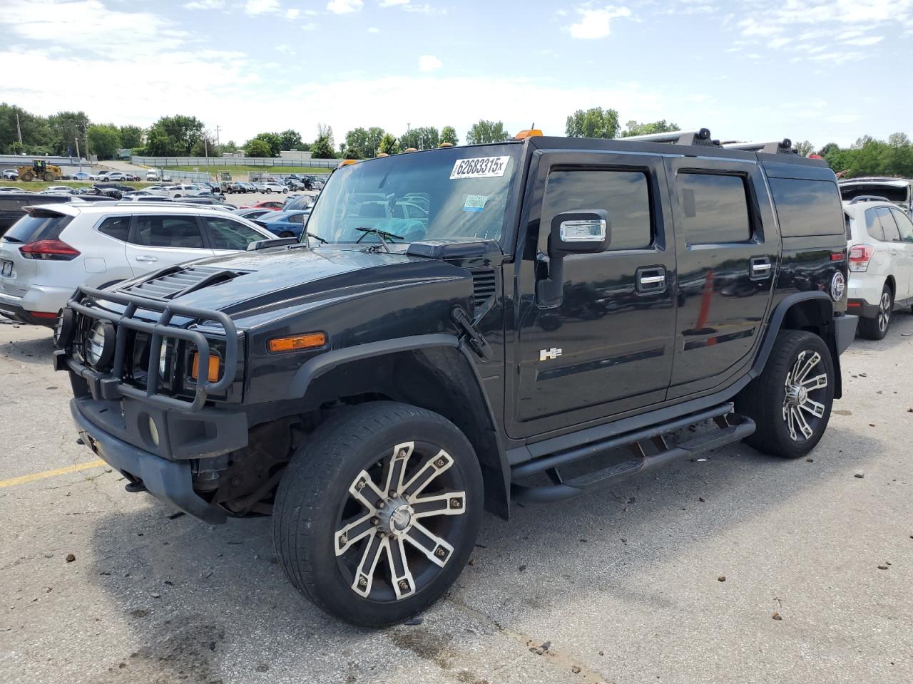 2003 Hummer H2, VIN 5GRGN23U33H130899 — Hail