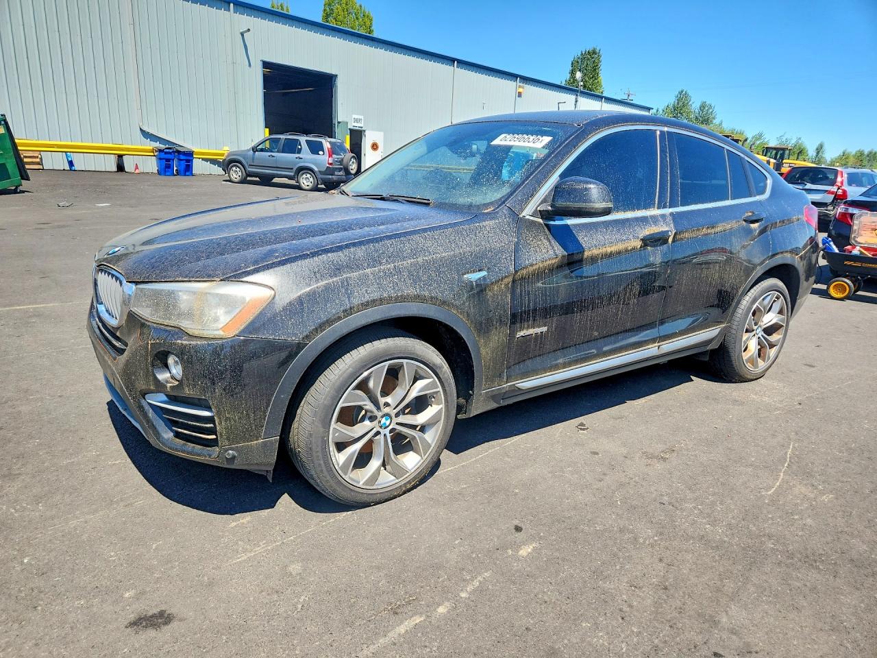 2016 BMW X4 xDrive28i, VIN 5UXXW3C51G0M90320 — Зад