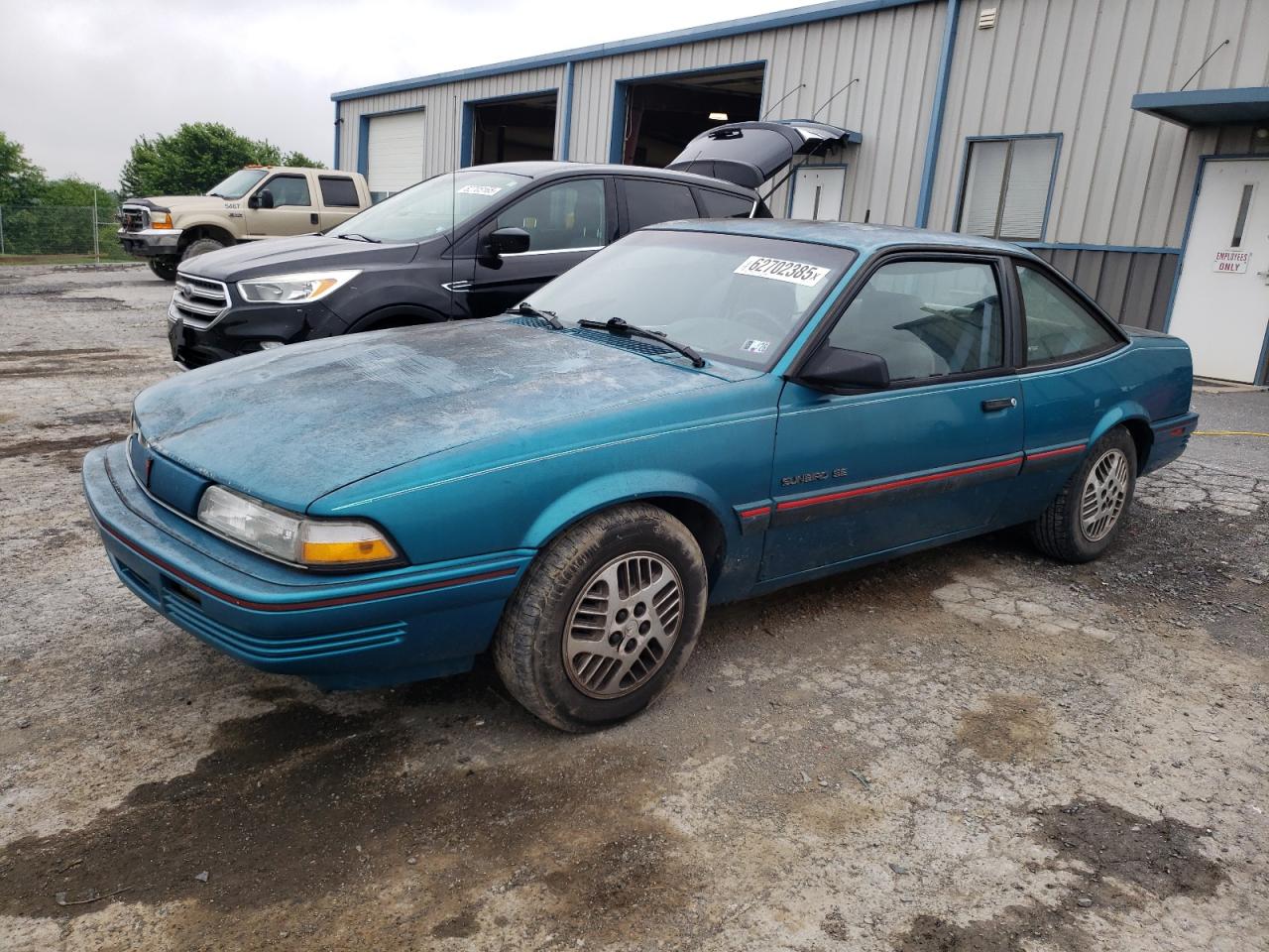 1993 Pontiac Sunbird, VIN 1G2JC14H4P7534125 — Side