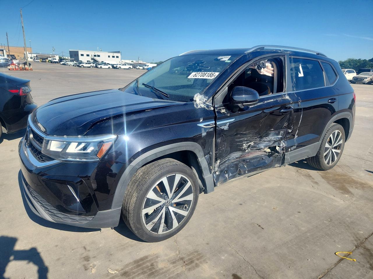 2023 Volkswagen Taos SE, VIN 3VVEX7B24PM372183 — Side