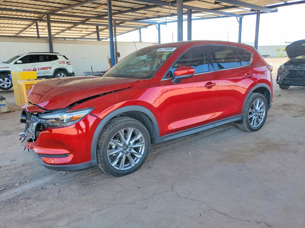 2021 Mazda CX-5 Grand Touring, VIN JM3KFADM7M1394176 — Front end
