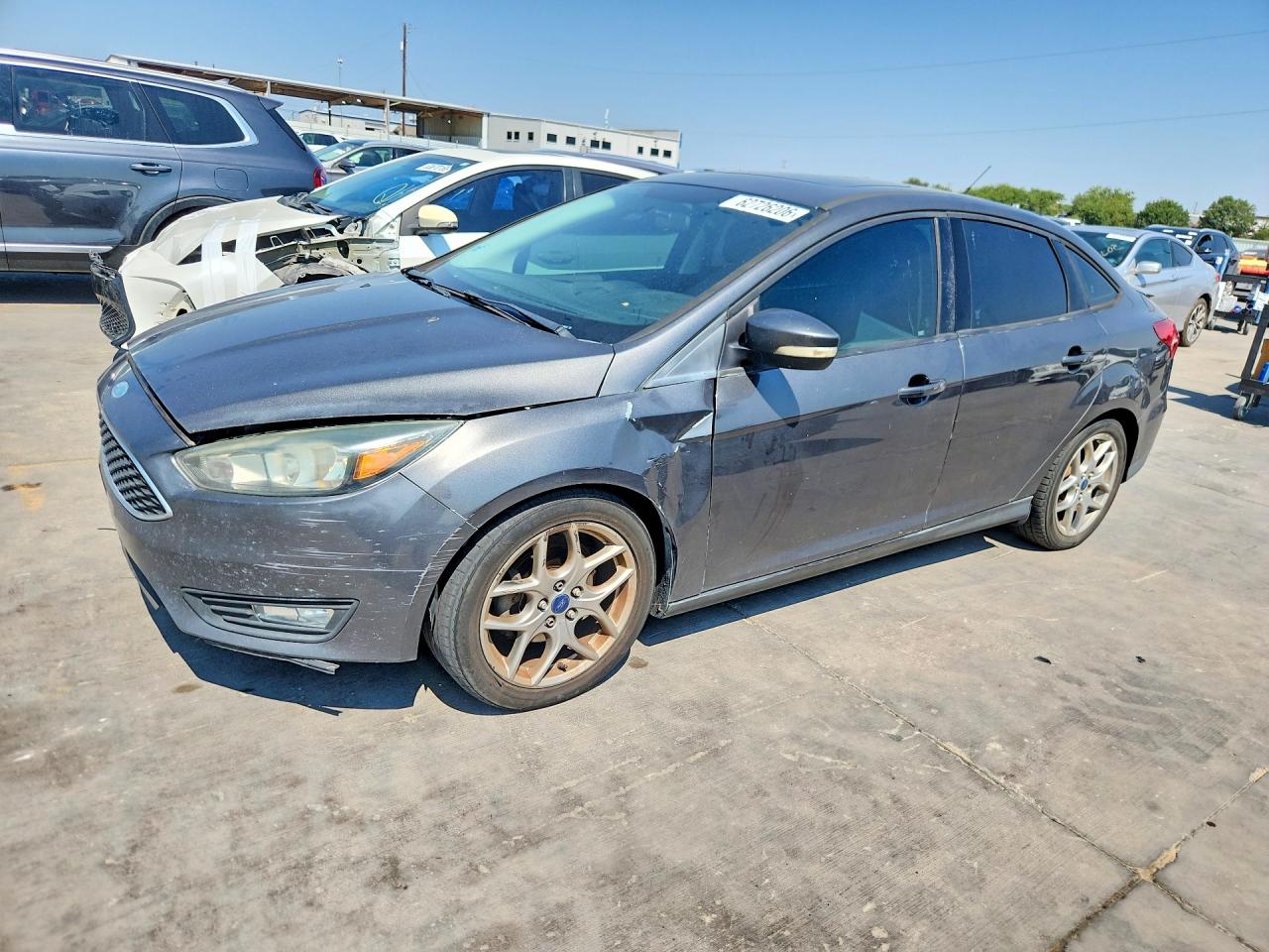 2015 Ford Focus SE, VIN 1FADP3F27FL210342 — Side