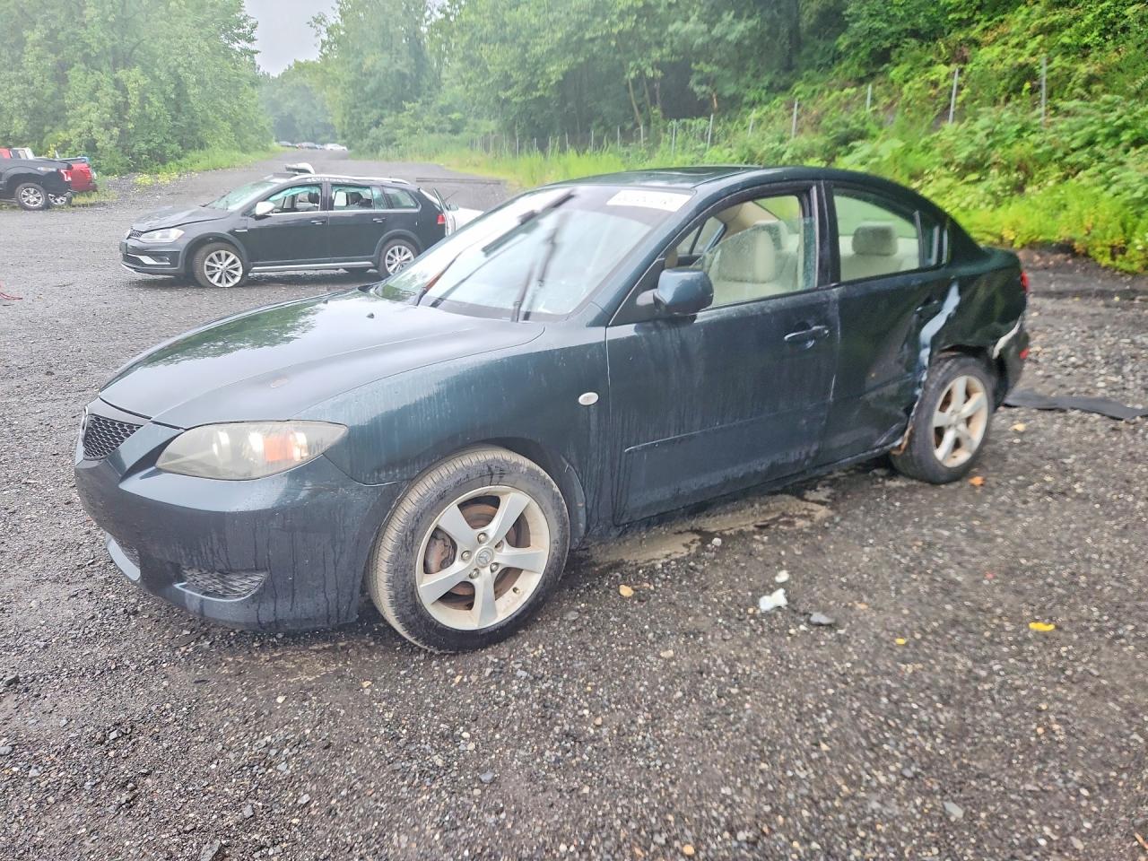 2004 Mazda 3 i, VIN JM1BK12F341134253 — Side