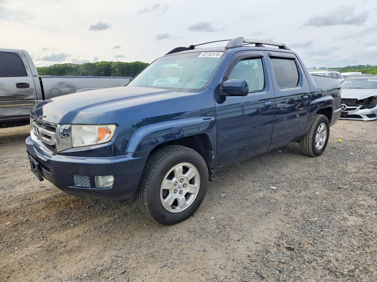 2009 Honda Ridgeline RTS, VIN 5FPYK16489B108191 — Side