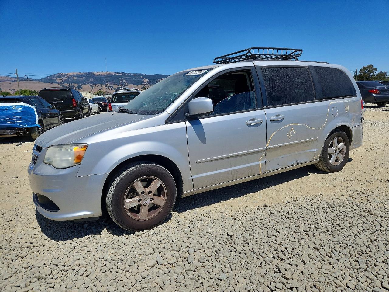 2012 Dodge Grand Caravan SXT, VIN 2C4RDGCG2CR223891 — Side