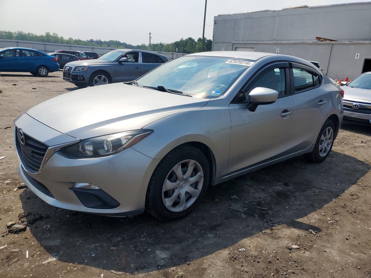 2014 Mazda 3 i Sport, VIN JM1BM1U71E1185381 — Бок
