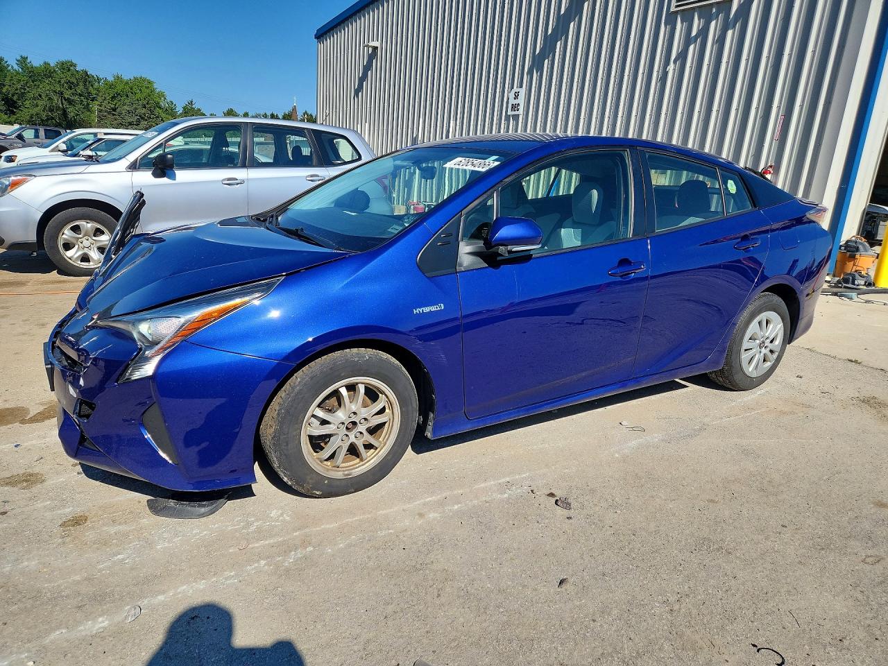 2016 Toyota Prius Two, VIN JTDKBRFUXG3527893 — Side