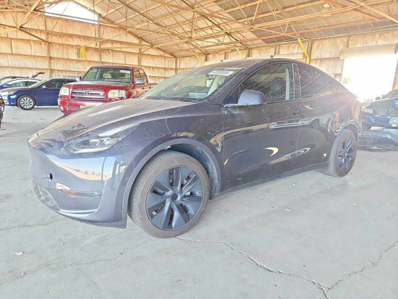 2024 Tesla Model Y, VIN 7SAYGDED2RF122121 — Front end