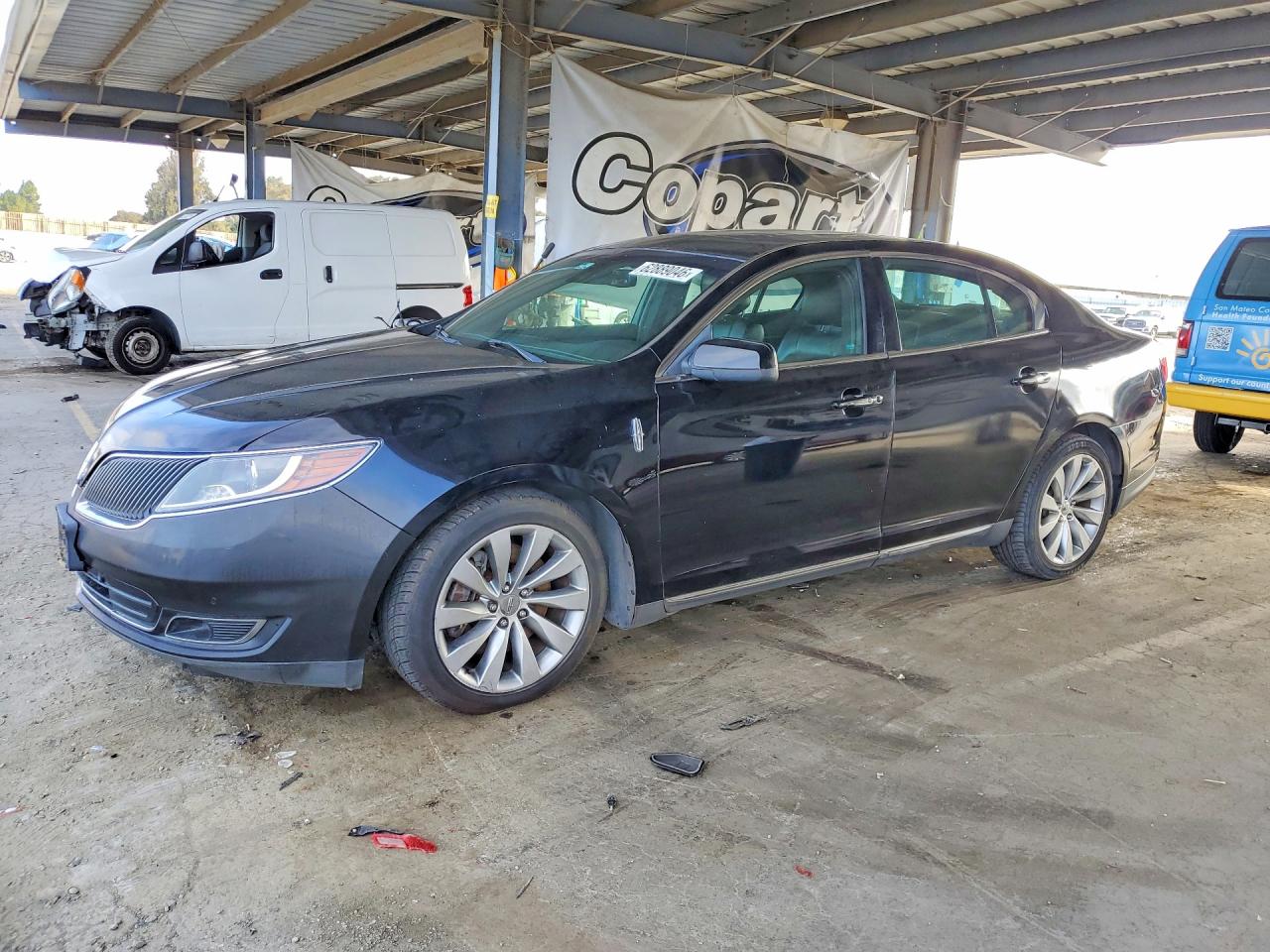 2016 Lincoln MKS, VIN 1LNHL9DK8GG602846 — Minor dents and scratches