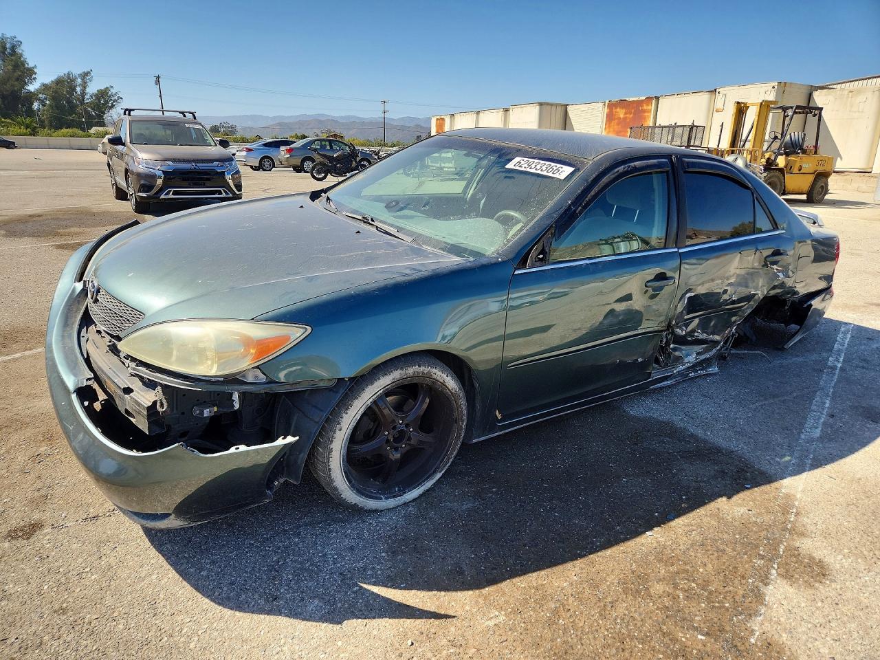 2002 Toyota Camry LE, VIN JTDBE32K720136672 — Side