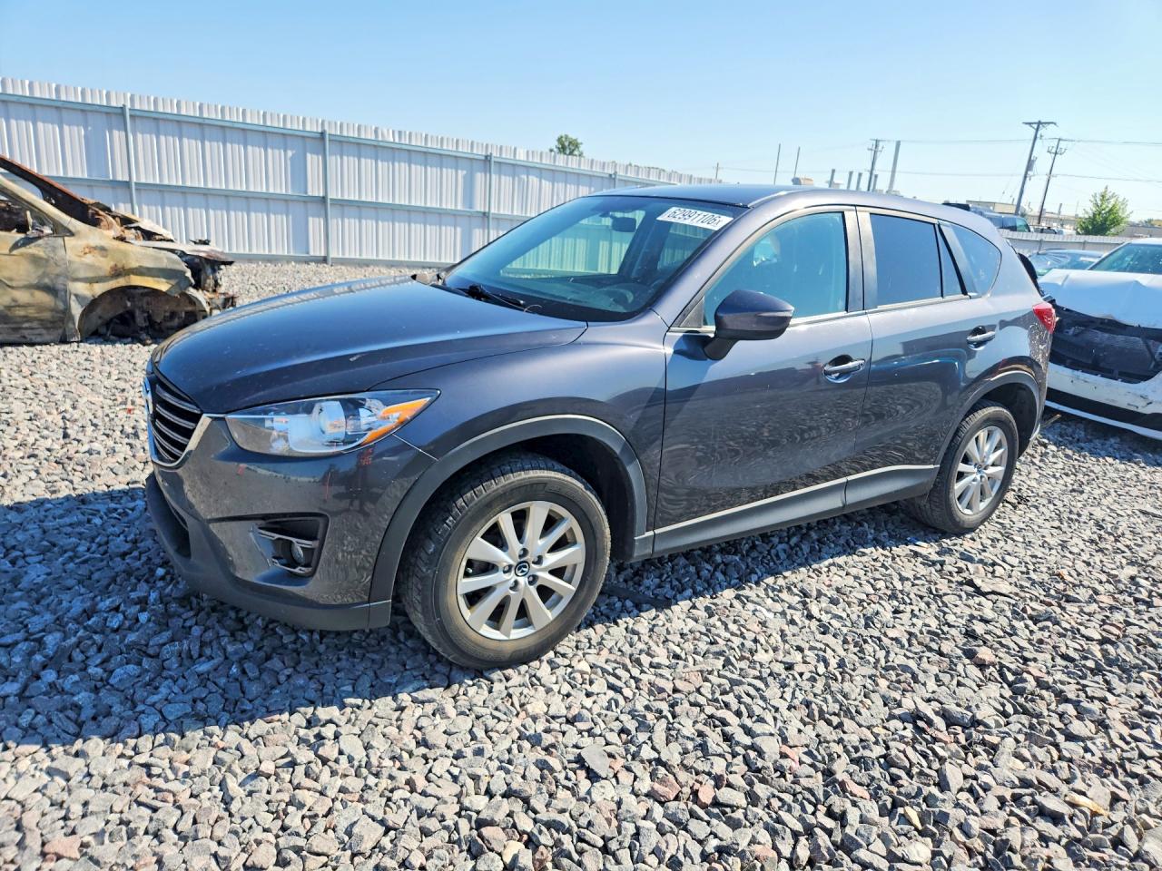 2016 Mazda CX-5 Touring, VIN JM3KE4CY7G0854701 — Rear end