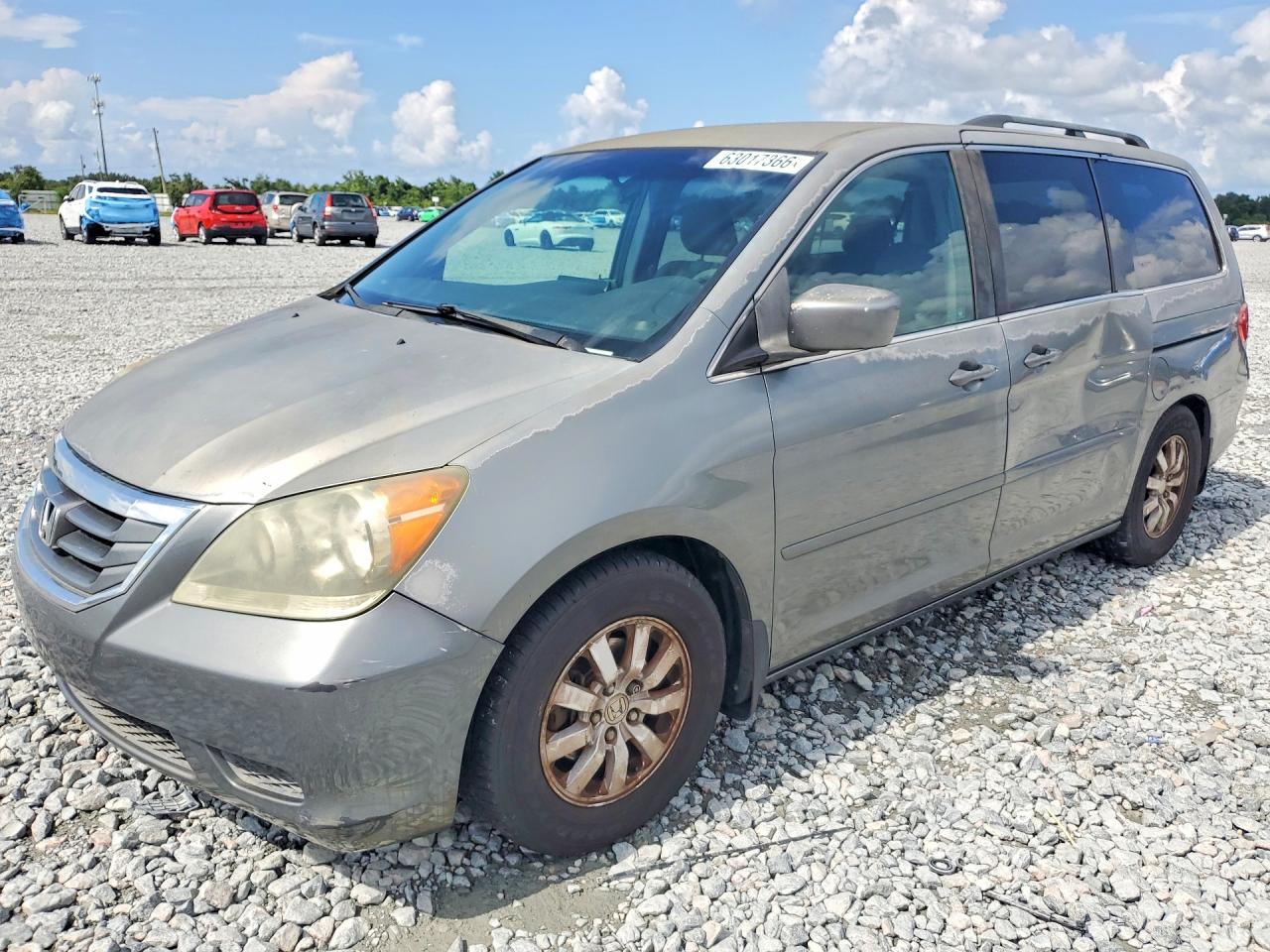 2009 Honda Odyssey EX, VIN 5FNRL38499B408308 — Side