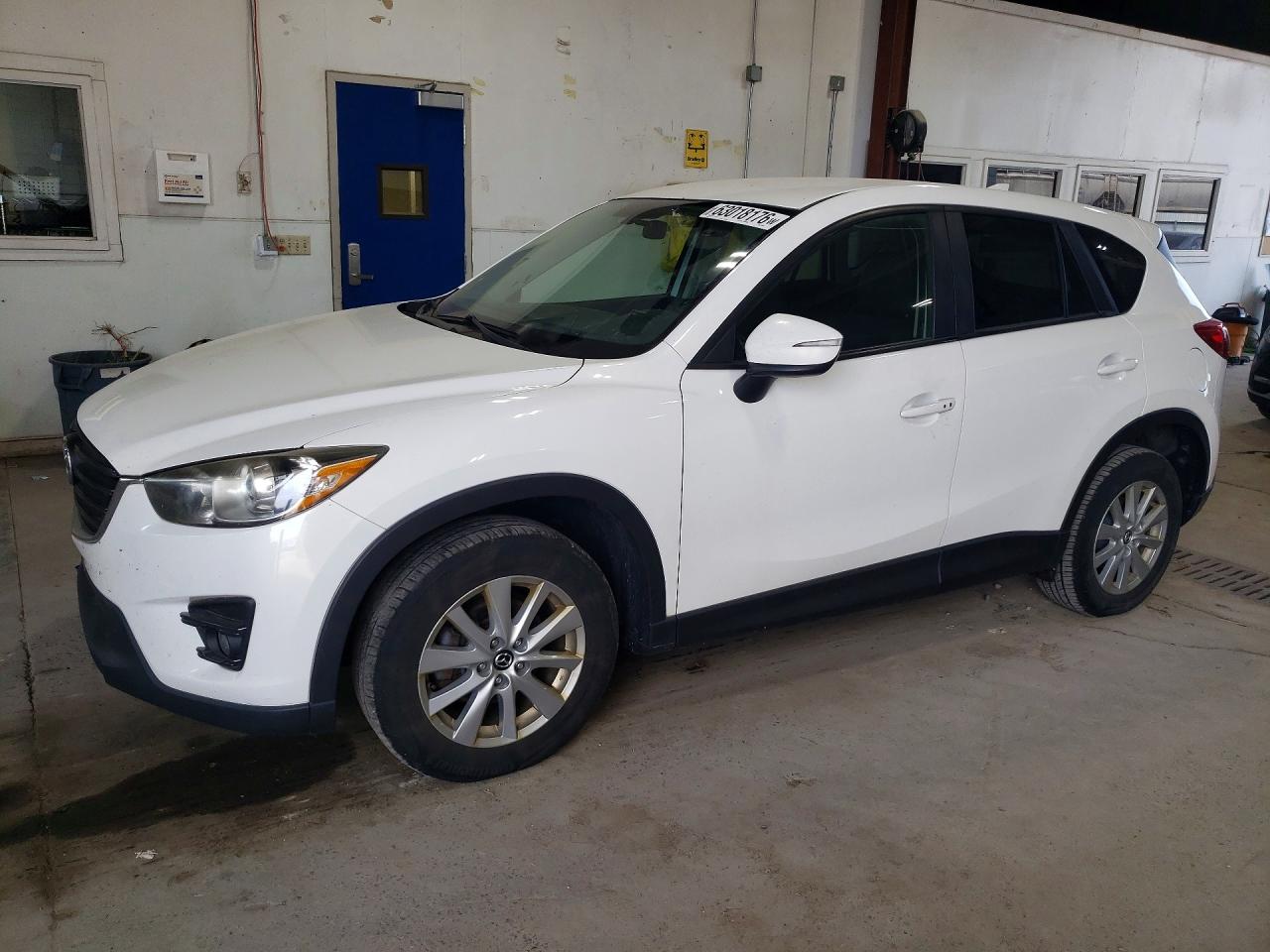 2016 Mazda CX-5 Touring, VIN JM3KE2CY3G0620088 — Minor dents and scratches