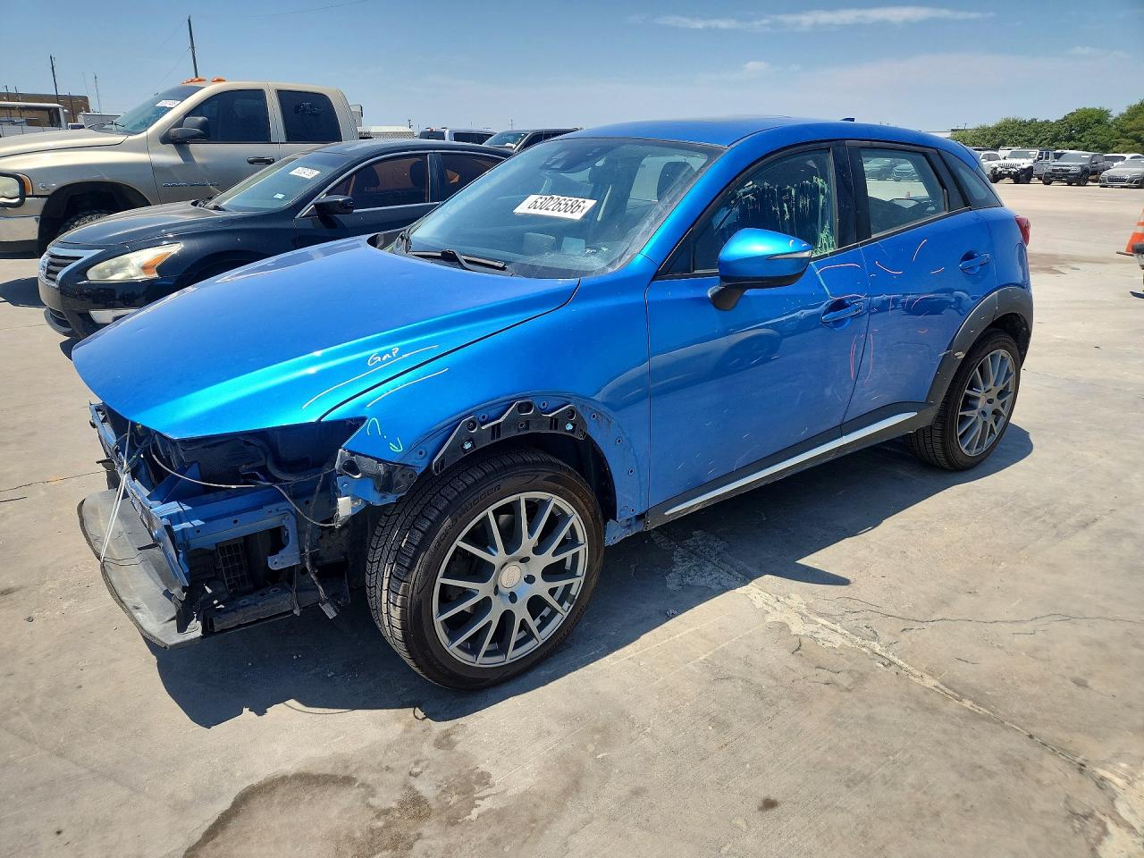 2016 Mazda CX-3 Grand Touring, VIN JM1DKFD75G0136186 — Front end